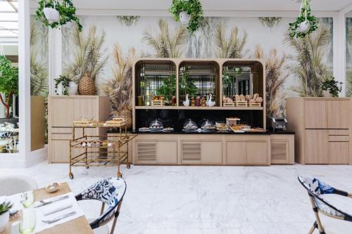 a store with a counter with shoes on display at Sofitel Dubai The Obelisk in Dubai