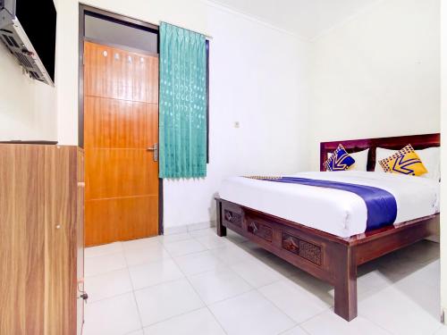 Giường trong phòng chung tại OYO Life 90152 Garuda Bima Residence Syariah