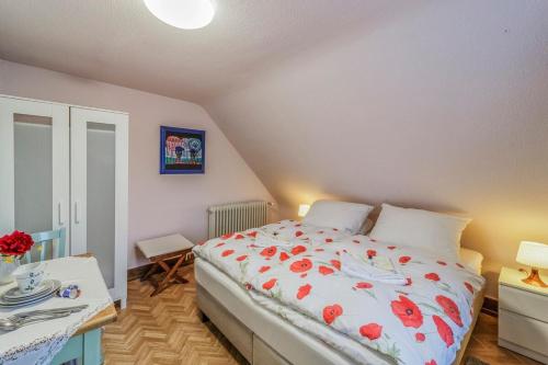 Postel nebo postele na pokoji v ubytování Gästehaus Sandvoss