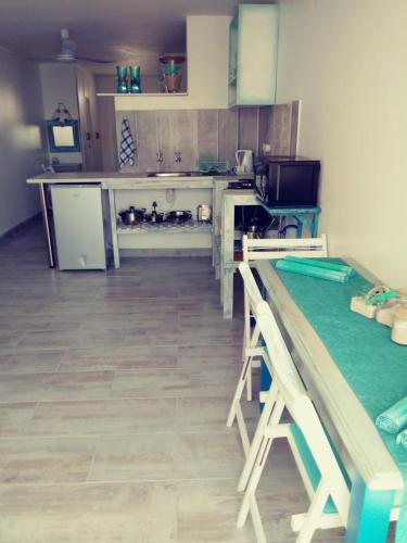 a kitchen with wooden counter tops in a room at Sandy Feet Self Catering Accommodation in Pearly Beach