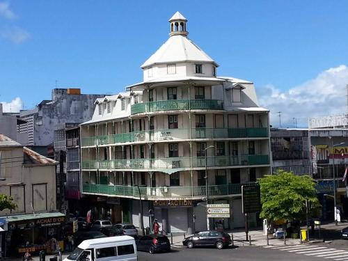 a large building with a tower on top of it at SCI Severin in Pointe-à-Pitre
