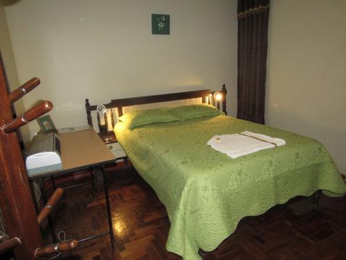 Ένα ή περισσότερα κρεβάτια σε δωμάτιο στο Hotel Sueños Dorados