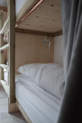 Postel nebo postele na pokoji v ubytování BodyGo Hostel