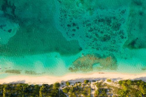 an aerial view of a beach and the ocean at Villa Islander in Providenciales