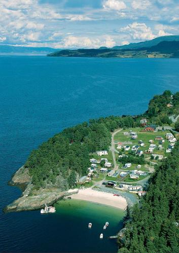 an aerial view of a small island in the water at Tråsåvika Camping in Viggja