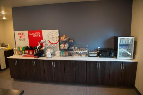 a counter in a room with a coffee shop at Cobblestone Inn & Suites - Forest City in Forest City