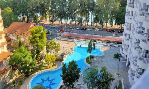 an aerial view of a pool at a resort at Adella Homestay Pantai Puteri - 5 min Klebang in Melaka