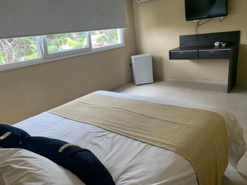 Una cama o camas en una habitación de Silenios