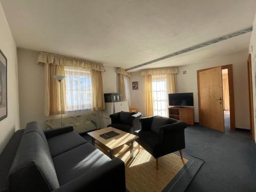 TV a/nebo společenská místnost v ubytování Hotel Alpin