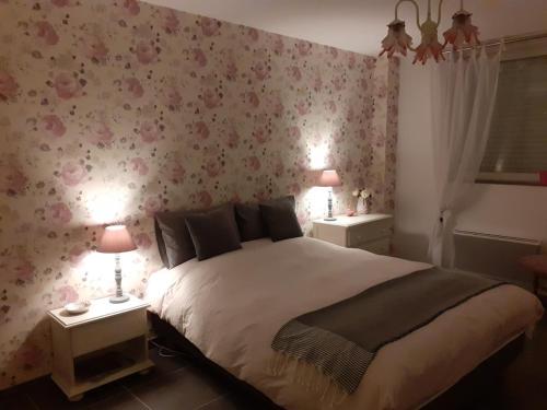 מיטה או מיטות בחדר ב-Gîte Carnot