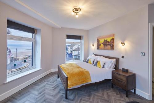 a bedroom with a bed and a large window at Host & Stay - Bellevue Apartments in Redcar
