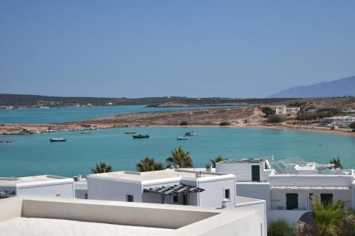 a view of a body of water with white buildings at Angels Pillow Luxury Boutique Residence - Adults Only in Naousa
