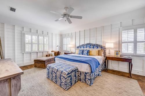 a bedroom with a bed and a ceiling fan at Camellia Villa in Saint Simons Island