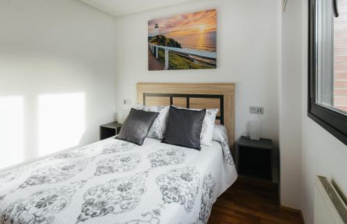 Ένα ή περισσότερα κρεβάτια σε δωμάτιο στο Apartamento MyM2