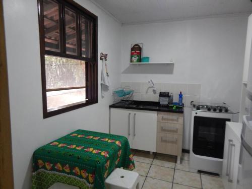 Kuchyňa alebo kuchynka v ubytovaní Residencial Brisa da Ilha do Mel