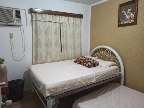 Ένα ή περισσότερα κρεβάτια σε δωμάτιο στο Ixtapa al mejor precio, "Casa las Conchas"