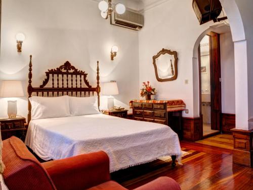 Кровать или кровати в номере Hotel Residencial Alentejana