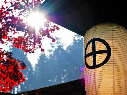 a peace sign on the side of a building at 高野山 宿坊 恵光院 -Koyasan Syukubo Ekoin Temple- in Koyasan