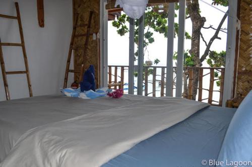 Postel nebo postele na pokoji v ubytování Blue Lagoon Dive Resort