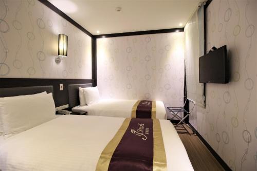 Posteľ alebo postele v izbe v ubytovaní J-HOTEL