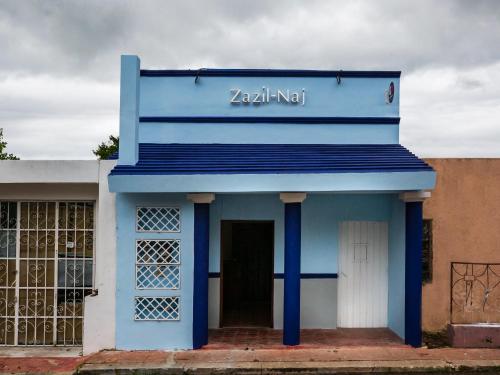 a blue building with a sign that reads zazi nt at Hotel Zazil-Naj in Valladolid