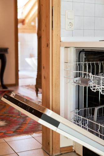 a dish drying rack with dishes in an oven at Ferienwohnung Hofmann in Eggstätt