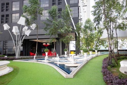 a rendering of a fountain in front of a building at ARTE MONT KIARA BY PSM Luxury Suites in Kuala Lumpur