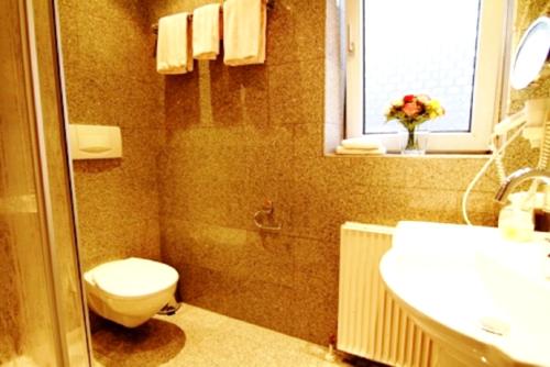 Et badeværelse på Charming Apartment in Westerland-Sylt, 35 m², garden