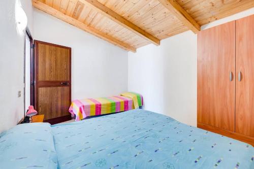 Charming apartment in Pisciotta, 37 m² with terraceにあるベッド