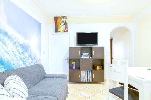 a living room with a couch and a table at Charming House in Costa Calma with Mountain View and Terrace in Costa Calma