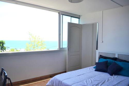 Voodi või voodid majutusasutuse Appartement vue mer Saint-Gilles 80 m² calme et confortable toas