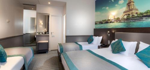 a hotel room with two beds and a bathroom at Elysées Ceramic in Paris