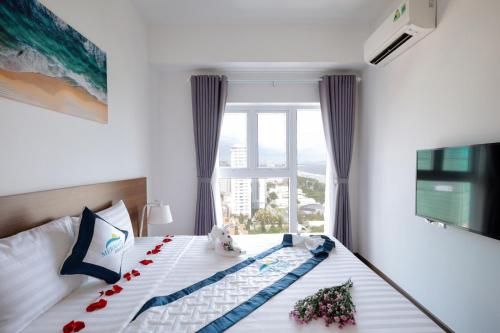Кровать или кровати в номере Mermaid Seaview Apartment Vung Tau