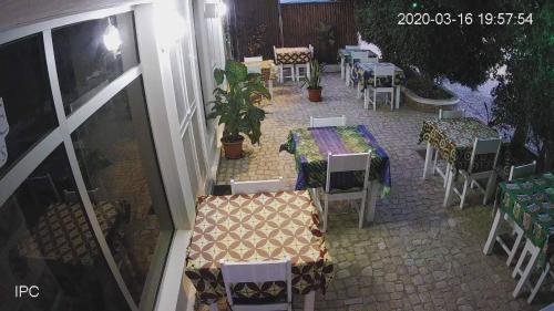 a patio with a table and chairs and a table and chairsktop at Hotel AH Maio in Vila do Maio