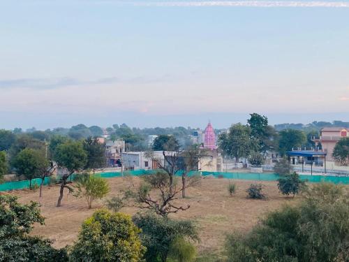 a view of a village with trees and buildings at Desert Nights in Mandāwa