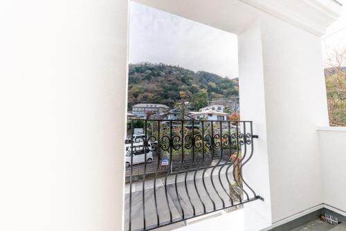 a balcony with a view of a city at The Guest Villa 箱根湯本 V-II in Hakone