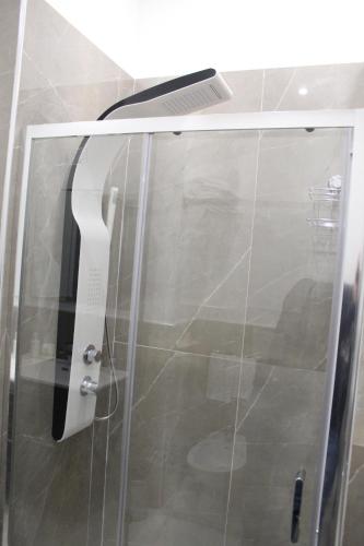 a glass door of a shower in a bathroom at B&B Carpe Diem in Palermo