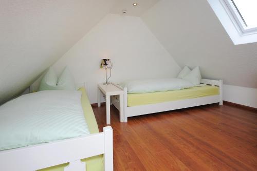 Postel nebo postele na pokoji v ubytování Ferienhaus Nike