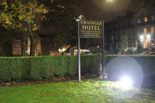 a sign that says cathedral hotel in a park at night at Grainger Hotel in Newcastle upon Tyne