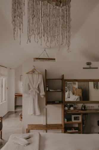 a robe hanging on the wall of a room at Qambathi Mountain Lodge in Kamberg Valley
