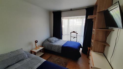 Postel nebo postele na pokoji v ubytování Dpto Concon