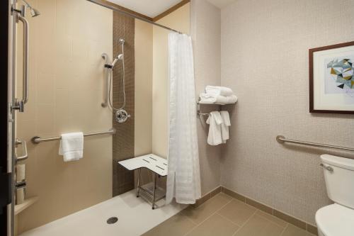 a bathroom with a shower and a toilet at Hyatt Place Sacramento Roseville in Roseville