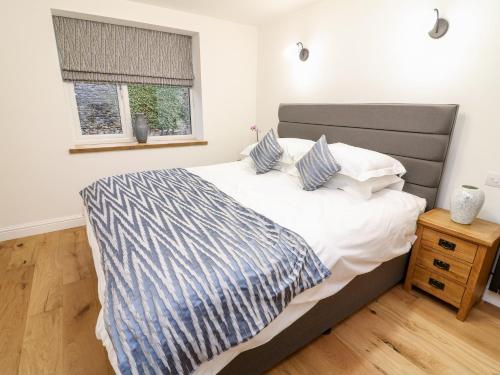 Säng eller sängar i ett rum på Macaw Cottages, No 4A