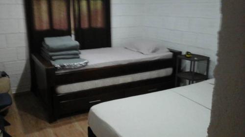 a pair of beds in a room with at Eco-Cabaña Termales Santa Rosa in Santa Rosa de Cabal