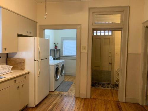 a kitchen with a refrigerator and a washer and dryer at Downtown big one bedroom unit 1322-#1 in San Antonio