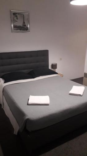 Postel nebo postele na pokoji v ubytování Chambres d'Hotes Centre Ville