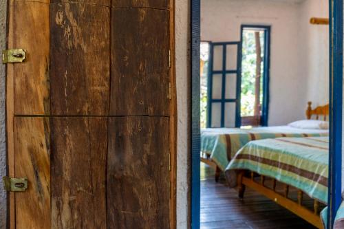 Una cama o camas en una habitación de Hostel Casa de Nelly