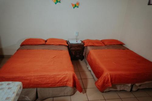 Una cama o camas en una habitación de Bungalows Flamingos