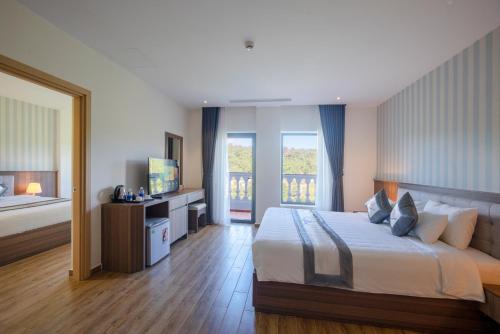 Cama o camas de una habitación en UMI-PQ hotel