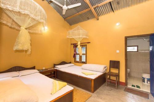 Piprahar Community Homestayにあるベッド